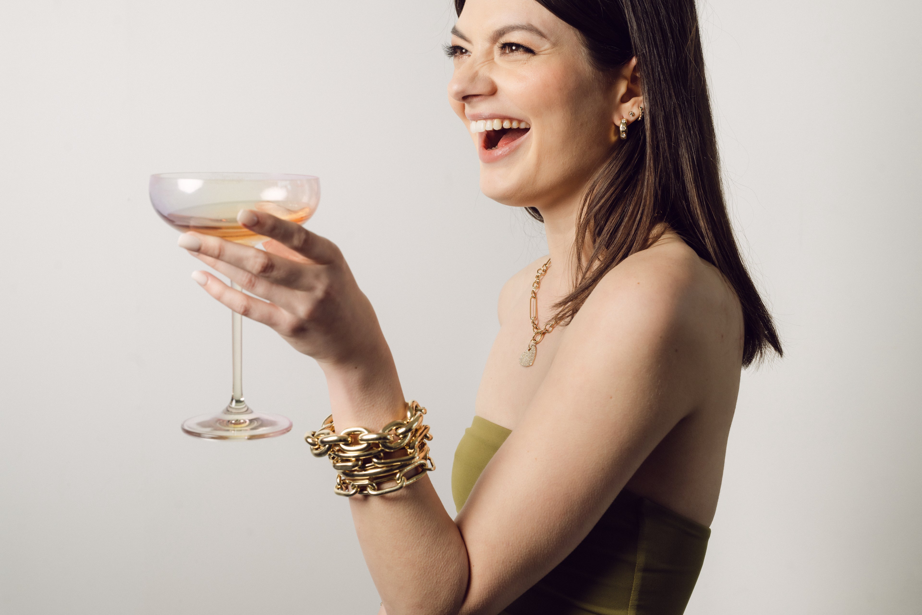 Girl holding a glass and smiling